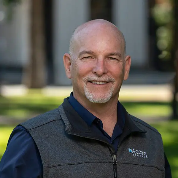 Bearded man outdoors, smiling in vest with Chuck Horton logo.
Bearded man outdoors, smiling in vest with Chuck Horton logo.